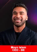The CEO of the BE Club, Moyn Islam, in a suit, smiling.